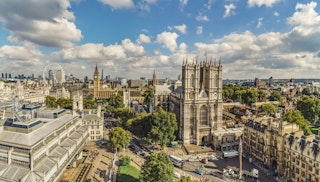 A high level view overlooking Westminster Abbey. Major sights included in this view are Westminster Abbey, Big Ben and Houses of Parliament, Shard, Canary Wharf and the Supreme Court.